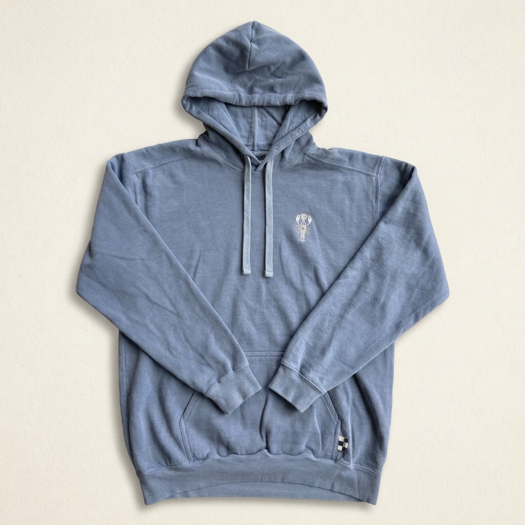 Harbor Blue Heritage Hoodie with white embroidered lobster and checkered hem tag